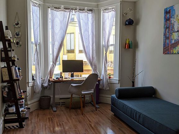 Front Bedroom with beautiful Bay windows looking out to Lexington St