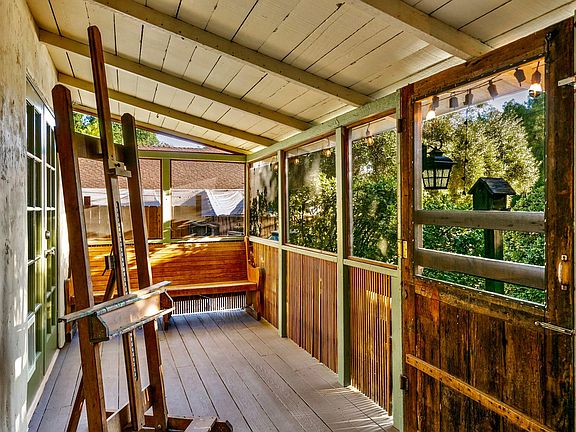 The large covered front porch is a lovely place to read, paint, relax or have an alfresco meal.