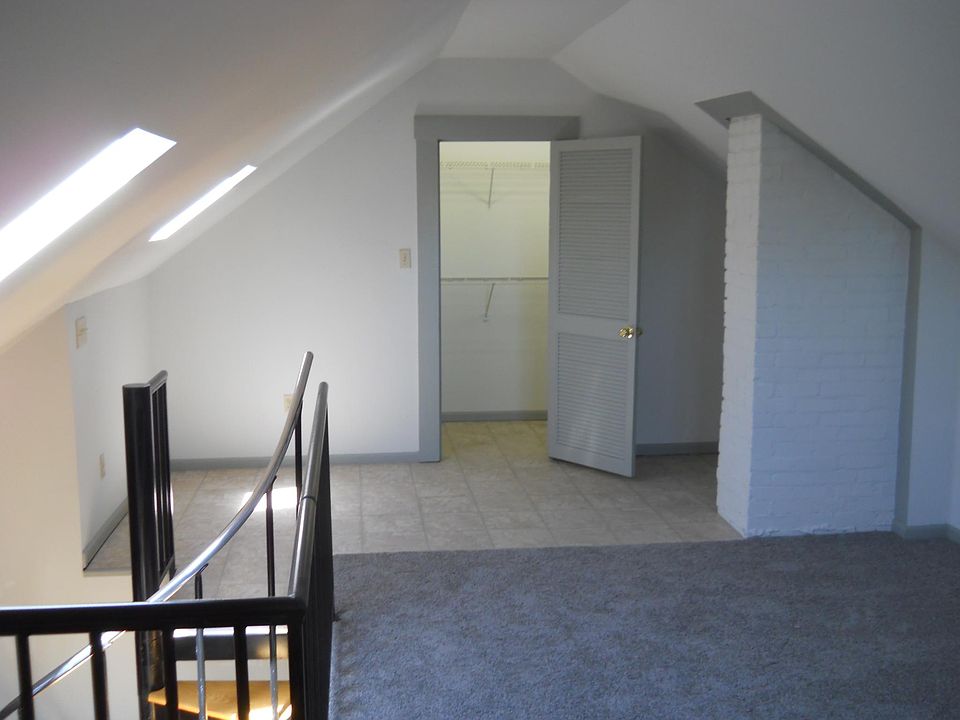 North half of Masterbedroom and large walk-in Closet. Features crank out skylight window on left.