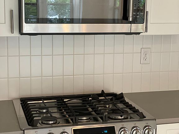 KitchenAid microwave and Samsung gas range