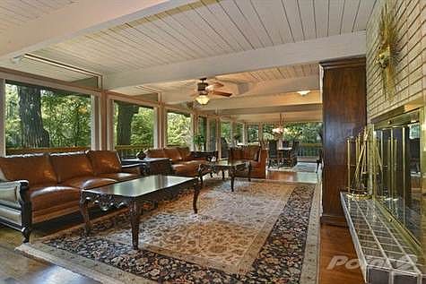 Spectacular view of Fabulous views of creek and woods from Living Room combined with Dining Room
