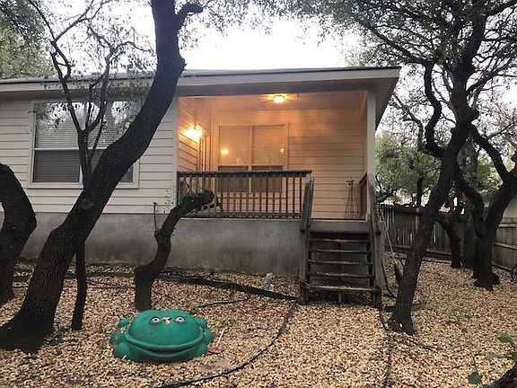 View of the covered back patio (Before you ask, the frog is a kid's sandbox).