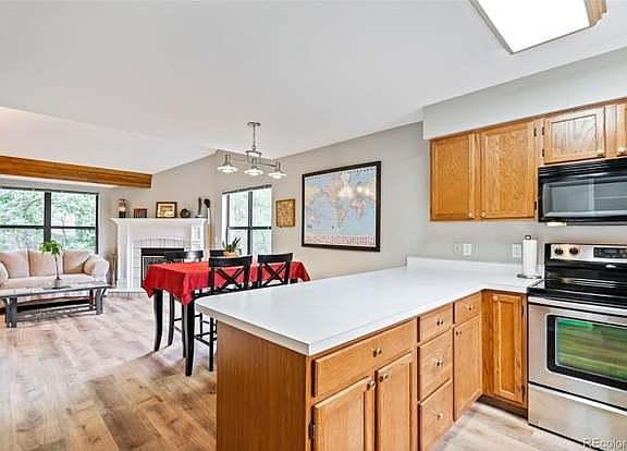 View of dining and living areas from kitchen.