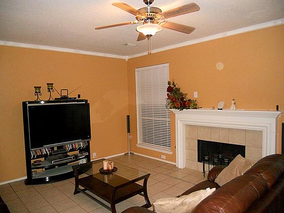 FAMILY ROOM W/COZY FIREPLACE & CROWN MOLDING