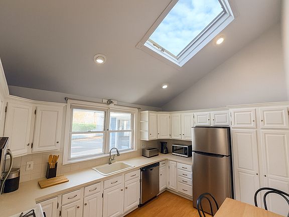 Eat in kitchen with stainless appliances