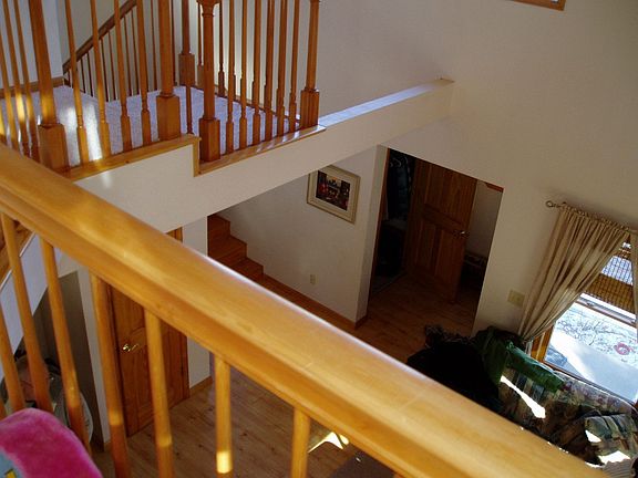 upper level loft overlooks lower level living space great for office.