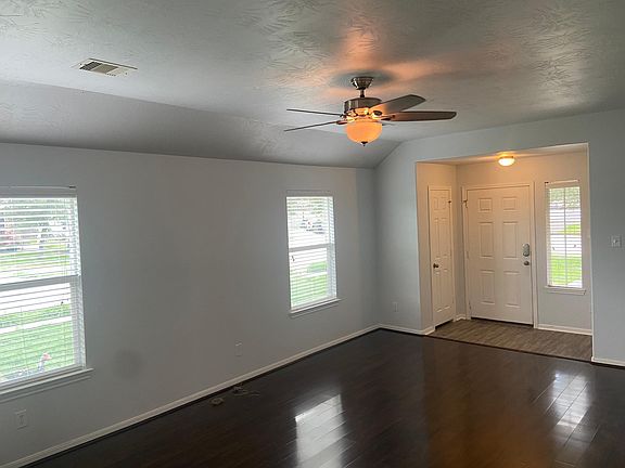 Living Room and entry is bright with natural light
