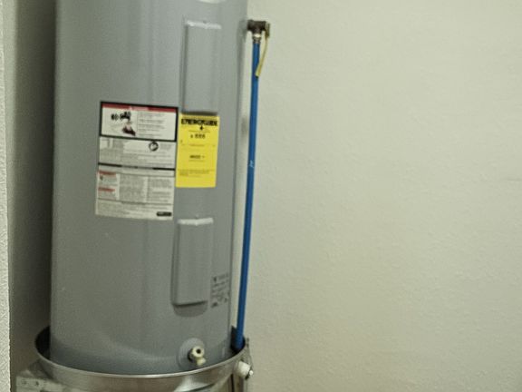 laundry room with washer/dryer connections and new hot water heater