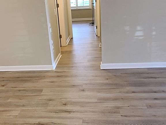 both bedrooms access via hallway adjacent to main room, with ample additional hallway storage cabinets