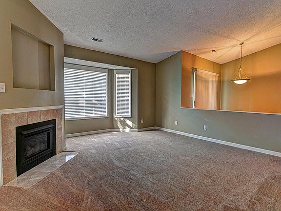 Entry & Living Area w/ Vaulted Ceilings & Dining