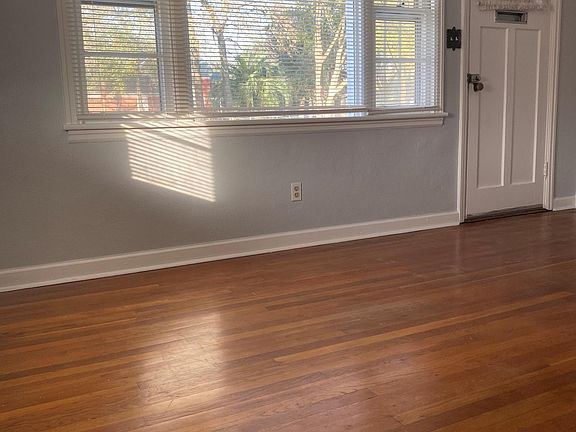 LIVING ROOM VIEW TO FRONT DOOR