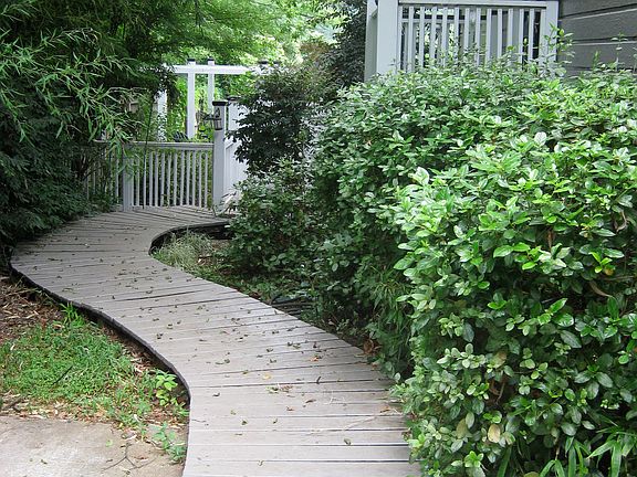 Boardwalk on side of house