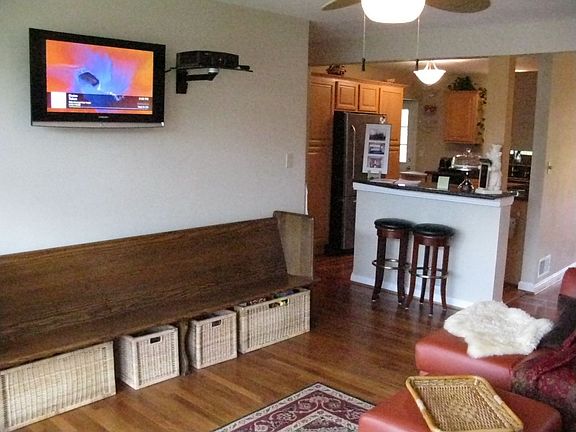 Living Room w/ bar to kitchen