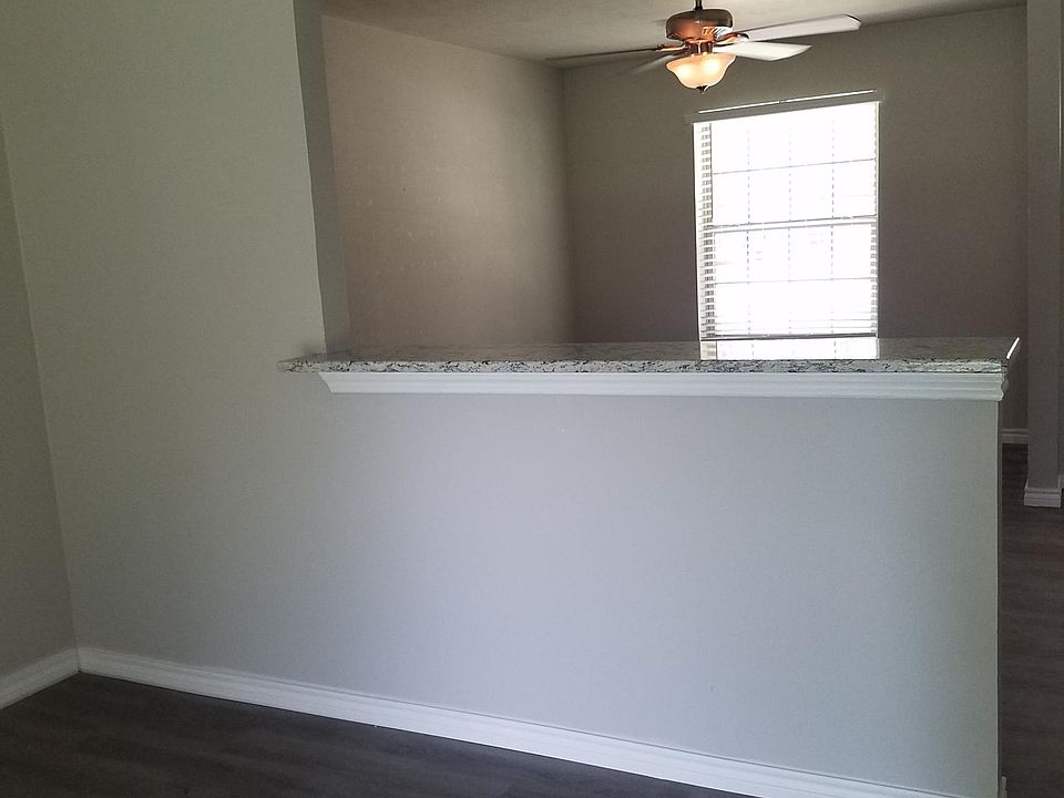 Living room, dining room, with granite bar top