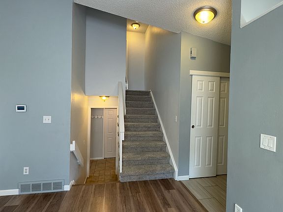 Up and downstairs, next to front door.