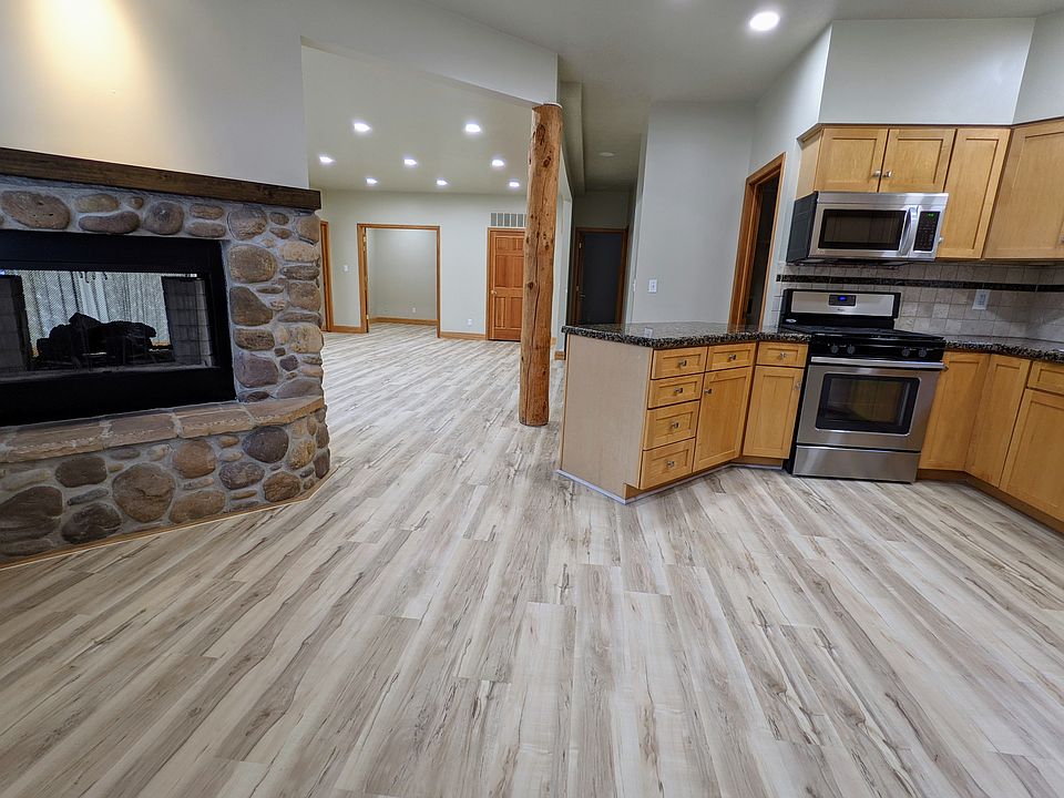 Kitchen, fireplace, and living room