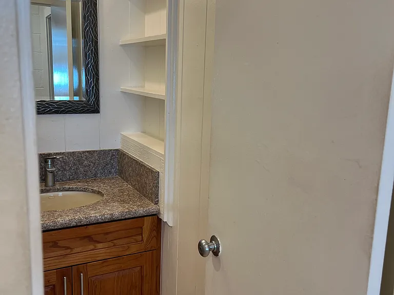 More storage cabinets in bathroom as well.