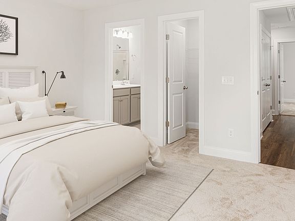 Owner s suite with walk-in closet en suite bathroom in a DRB Homes Brookgreen model home at Park C