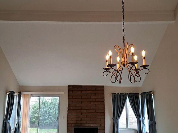 Living room with fireplace and patio access