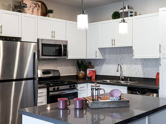 Kitchen with Breakfast Bar Ample Cabinet Space and Self Closing Drawers