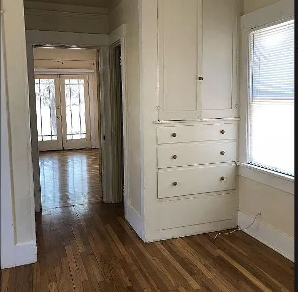 Bedroom 3 has built in drawers and shelfs in addition to a closet.