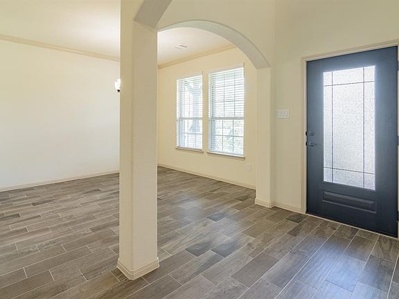 As you walk in, there is a open formal dining to the right.