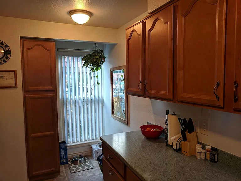 Window facing parking lot, more counter space and cabinets.