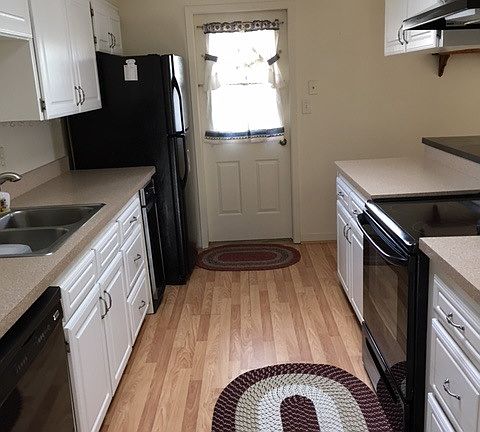Kitchen with breakfast bar, open to the family room