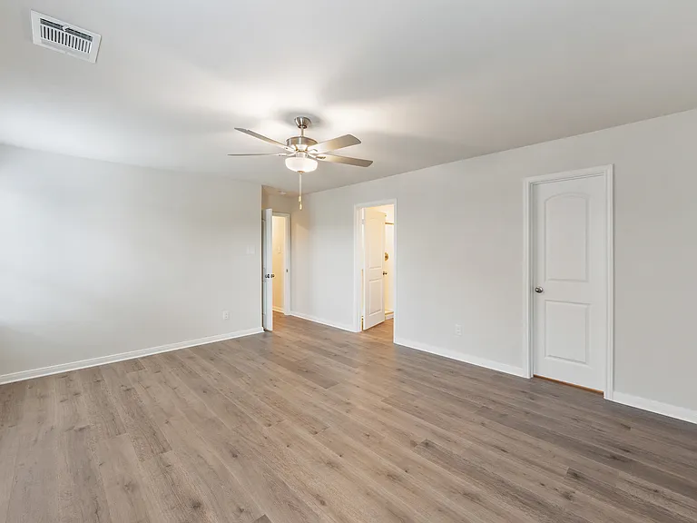 The master suite has a large bedroom, ensuite bathroom and a large walk-in closet.