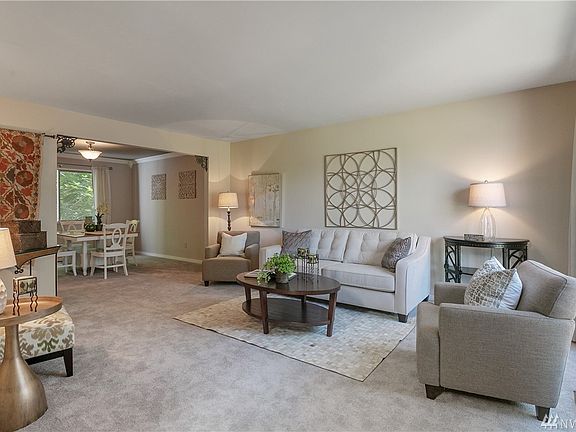 Spacious living room with fresh carpet, updated trim and paint!