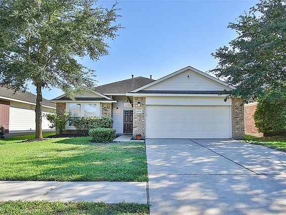 Exterior is maintenance free; brick and wood exterior. Even after the Texas freeze, the plants/trees are still green and thriving.
