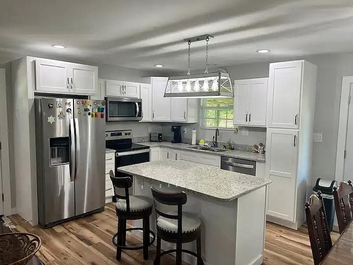 Brand new kitchen to cook up some delicious meals! New cabinets, countertops, appliances, and a huge kitchen island!