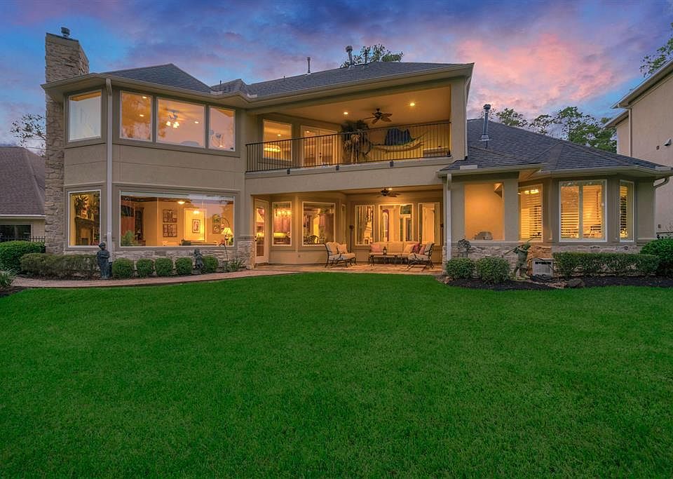 Now you can see the inviting covered porch and balcony. Featuring slate flooring, ceiling fans, a summer kitchen and large entertaining spaces.