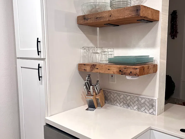 Pantry with pull-out shelving. Dishes are included.