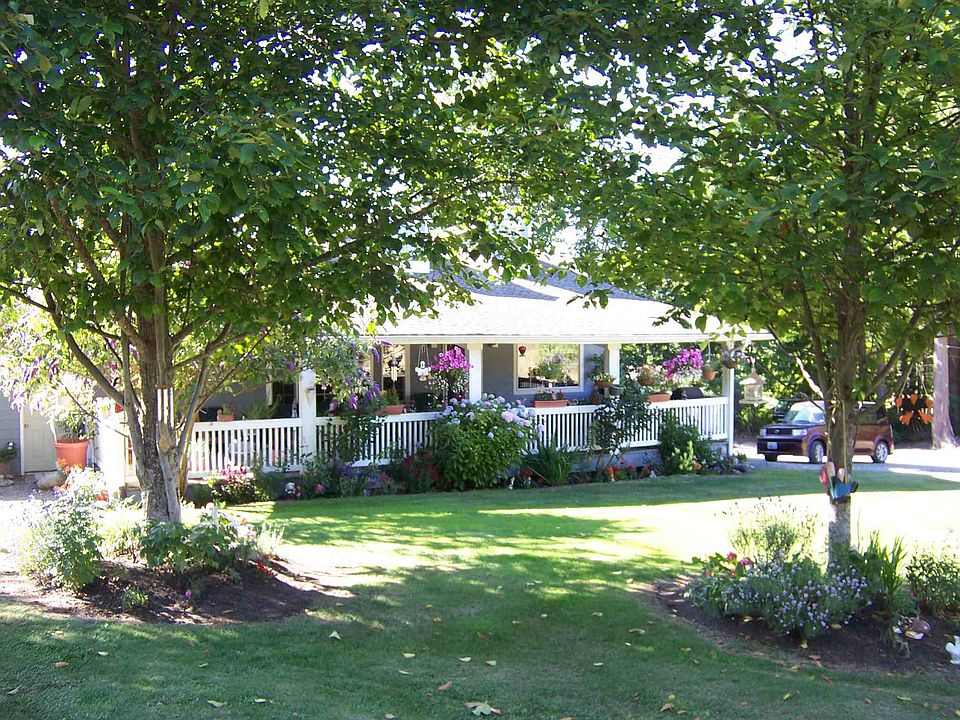 A cozy country cottage with a great room design. The home was designed for entertaining inside and out.