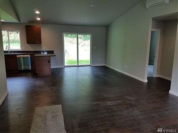 Open family room with vaulted ceilings. 