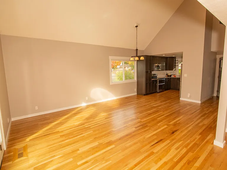 View of kitchen from corner of living area (near the french doors to the backyard).