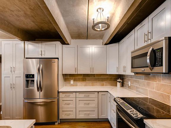 The renovated kitchen sports brand new stainless steel appliances and new cabinetry. Tons of storage.