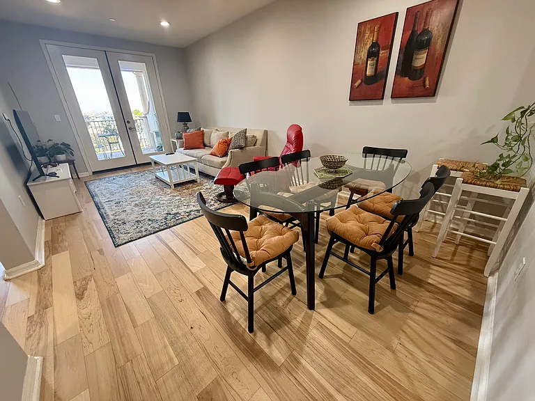 Dining area flows to the living room and onto the patio terrace.