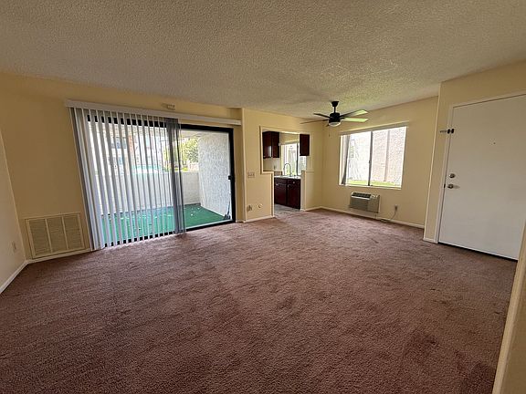 Spacious Living Room with new ceiling fan and wall mounted AC