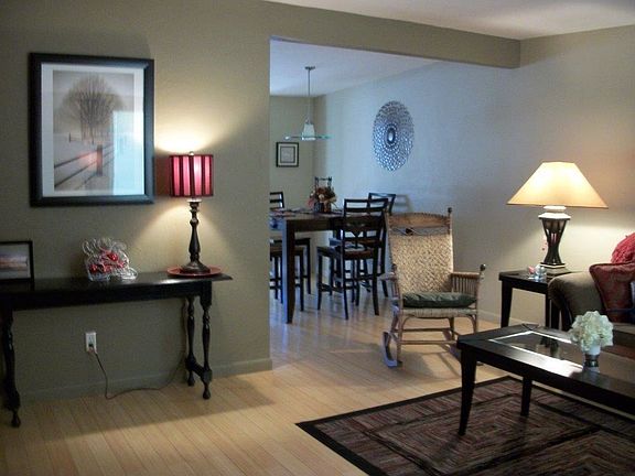 Open floor plan with bamboo floors comfortable living room -