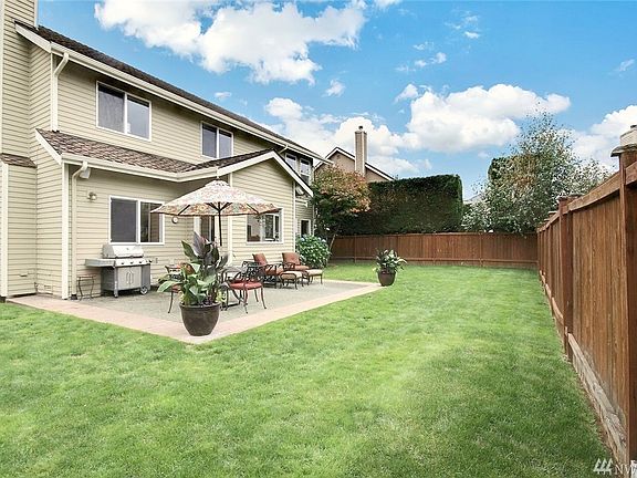 Entertainment sized patio and level, fully fenced backyard.