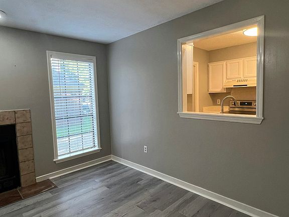 Kitchen with Window Looking Through Living Room