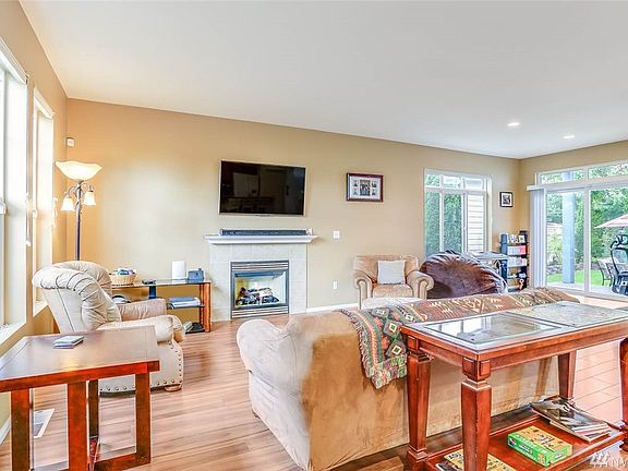 Enter to tall ceilings and engineered hardwood flooring.