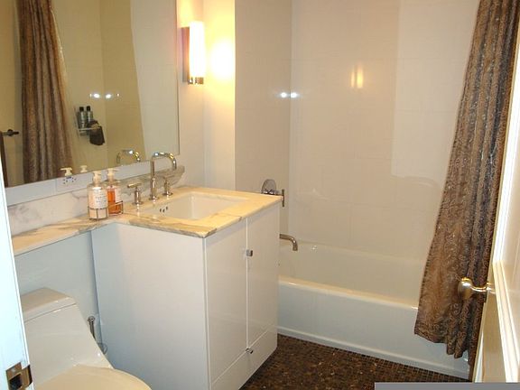 modern bathroom with kohler fixtures and marble finishes