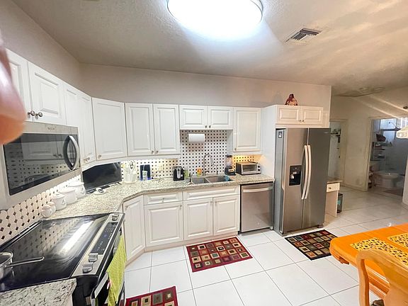 5th image of 9858 Royal Palm Boulevard #3-14