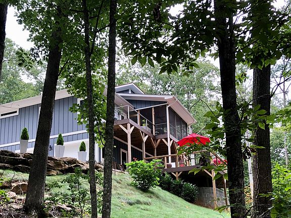 VIEW FROM THE WOODED BACK OF THE HOUSE
