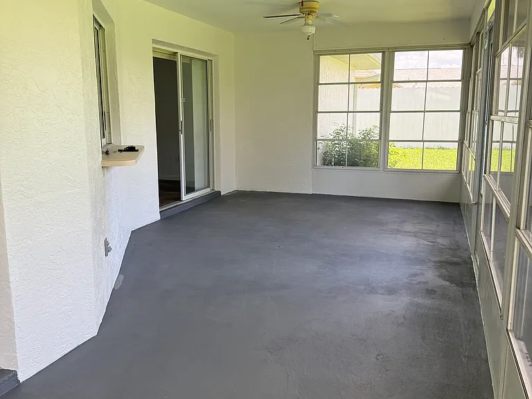 Screened patio showing slider access from dining room