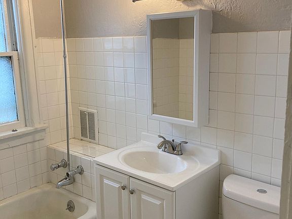 Bathroom with new vanity, sink, medicine cabinet, toilet, new paint