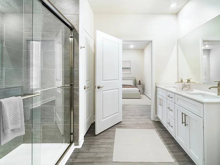 A spacious primary bath at Amavi Brier Creek, finished with clean lines and modern details, moments from the convenience of Durham's Brier Creek area.